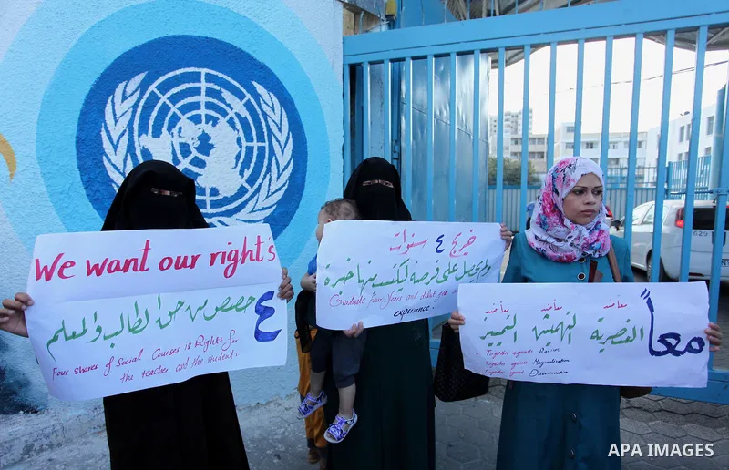 Palestinian teachers and graduates take part a protest demanding their rights in front of the headquarters United Nations Relief and Works Agency (UNRWA), in Gaza City, on Sept. 18, 2016. Photo by Ashraf Amra
