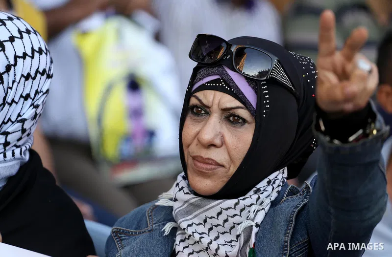 Palestinian supporters of Fatah movement take part during a protest to show solidarity with Palestinian prisoners on hunger strike in Israeli Jails, in front of Red cross office in Gaza city, on Sept. 18, 2016. Photo by...