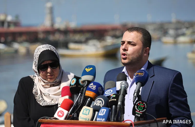 Spokesman of the National Commission to break the siege Adham Abu Salmiya, speaks during a press conference at the seaport in Gaza city on Sept. 20, 2016. Photo by Mohammed Asad