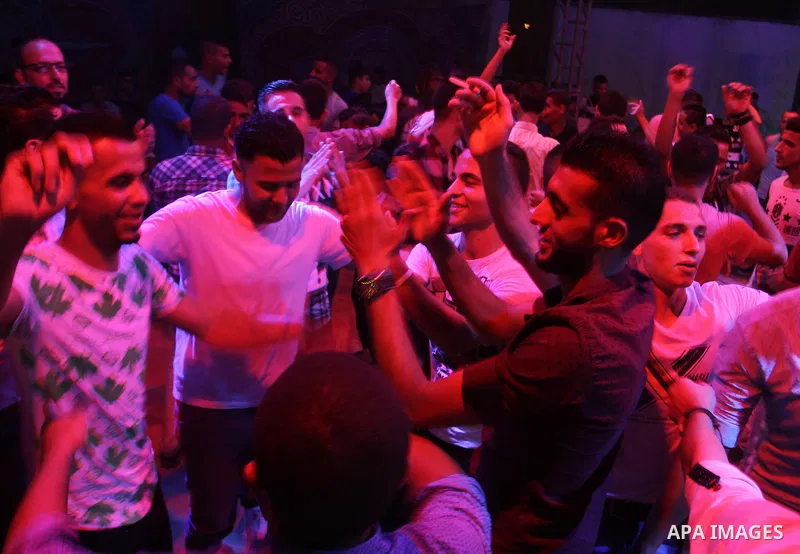 Palestinians celebrate during a traditional wedding party in Arabic "Henna's Night" in Rafah in the southern Gaza strip on Sep. 20, 2016. Palestinians perform the traditional dancing style derived from their folklore, th...