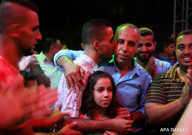 Palestinians celebrate during a traditional wedding party in Arabic "Henna's Night" in Rafah in the southern Gaza strip on Sep. 20, 2016. Palestinians perform the traditional dancing style derived from their folklore, th...