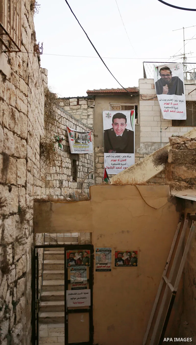 A Poster bearing pictures of Palestinian prisoners Mohammed and Mahmoud Balboul who are on hunger strike is seen in their house in the West Bank city of Bethlehem on Sep. 20, 2016. Mohammed Balboul began his own hunger s...