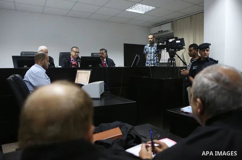 Palestinian high court judges speak in the West Bank city of Ramallah on September 21, 2016 as they announce the delay of local elections. Palestinian municipal polls scheduled for October 8 were officially postponed aft...