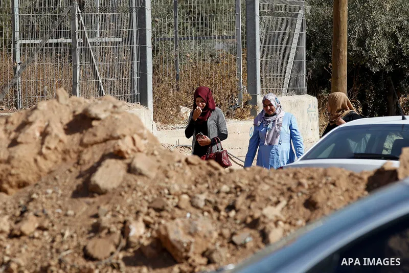 Palestinians cross the closed at the entrance to the West Bank village of Bani Na'im, near Hebron September 21 2016. the Israeli army applied a closure at areas where Palestinian assailants live or attacked Israeli troop...