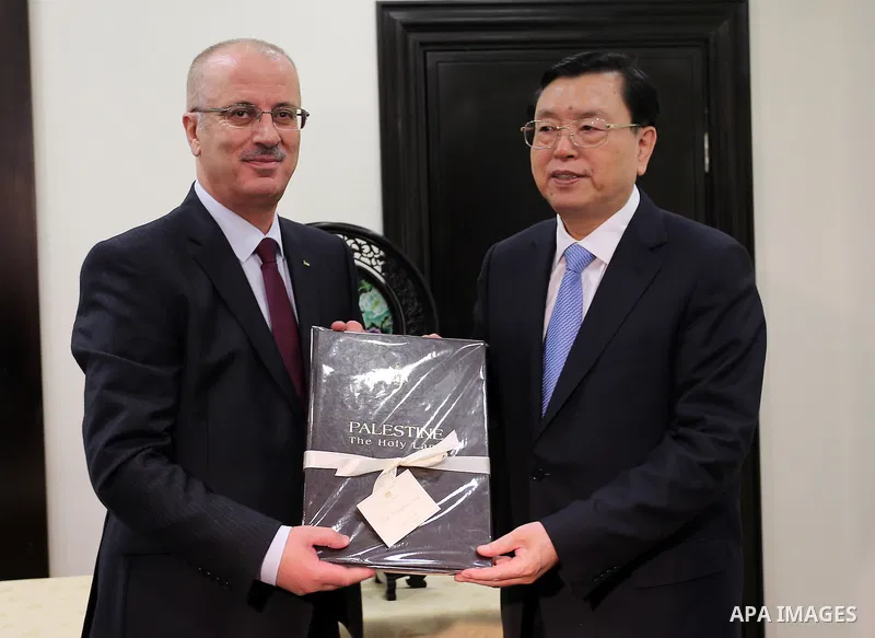 Palestinian Prime Minister, Rami Hamadallah, meets with the Chairman of the House of Representatives of the ruling party in China, Zhang De Jiang, in the West Bank city of Ramallah, on Sept 21, 2016. Photo by Prime Minis...