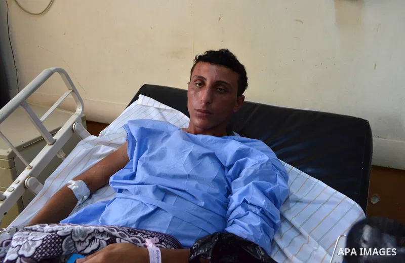 A rescued migrant lies in bed as he receives treatment at Rashid hospital in the port city of Rosetta, north of Cairo, Egypt, September 22, 2016. Egypt's official news agency MENA said the boat was carrying 600 people wh...