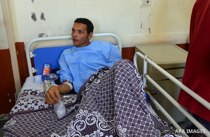 A rescued migrant lies in bed as he receives treatment at Rashid hospital in the port city of Rosetta, north of Cairo, Egypt, September 22, 2016. Egypt's official news agency MENA said the boat was carrying 600 people wh...