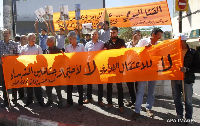 Palestinians take part in a protest demanding Israel return the bodies of Palestinians who allegedly stabbed Israelis, in the West Bank city of Hebron Sept. 24, 2016. 16. Photo by Wisam Hashlamoun