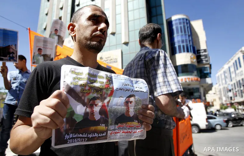 Palestinians take part in a protest demanding Israel return the bodies of Palestinians who allegedly stabbed Israelis, in the West Bank city of Hebron Sept. 24, 2016. 16. Photo by Wisam Hashlamoun