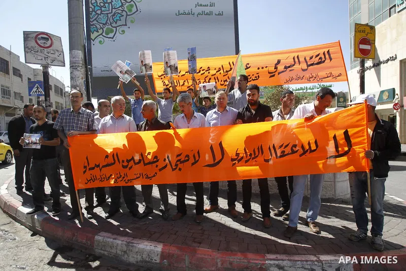 Palestinians take part in a protest demanding Israel return the bodies of Palestinians who allegedly stabbed Israelis, in the West Bank city of Hebron Sept. 24, 2016. 16. Photo by Wisam Hashlamoun
