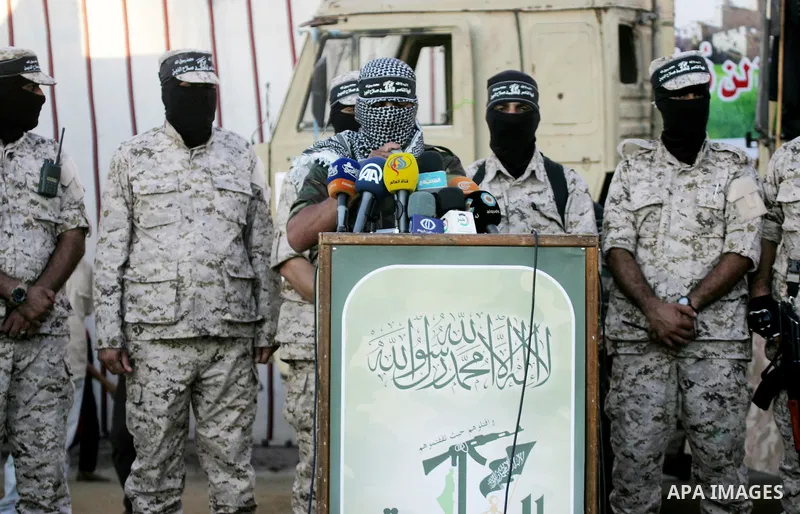 Palestinian militants from the Al-Nasser Brigades, an armed wing of the Popular Resistance Committees (PRC), take part during a rally in Rafah in the southern Gaza Strip on September 26, 2016, to mark the 17th anniversar...