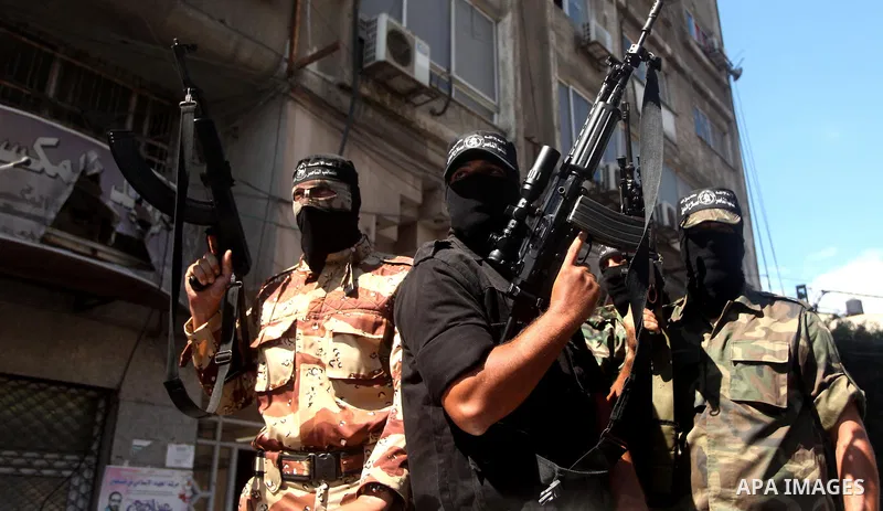 Palestinian militants of the Nasser Salah al-Din Brigades the military wing of the Popular Resistance movement take part in a press conference, in Gaza City on Sept. 27, 2016. Photo by Ashraf Amra