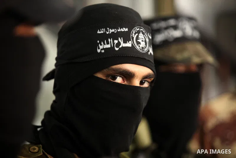 Palestinian militants of the Nasser Salah al-Din Brigades the military wing of the Popular Resistance movement take part in a press conference, in Gaza City on Sept. 27, 2016. Photo by Ashraf Amra