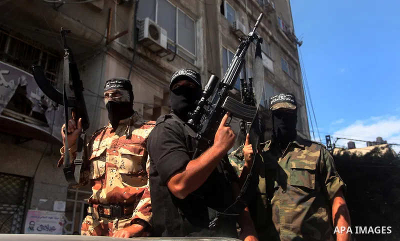 Palestinian militants of the Nasser Salah al-Din Brigades the military wing of the Popular Resistance movement take part in a press conference, in Gaza City on Sept. 27, 2016. Photo by Ashraf Amra