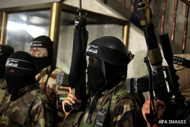 Palestinian militants of the Nasser Salah al-Din Brigades the military wing of the Popular Resistance movement take part in a press conference, in Gaza City on Sept. 27, 2016. Photo by Ashraf Amra
