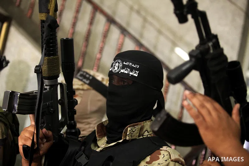 Palestinian militants of the Nasser Salah al-Din Brigades the military wing of the Popular Resistance movement take part in a press conference, in Gaza City on Sept. 27, 2016. Photo by Ashraf Amra