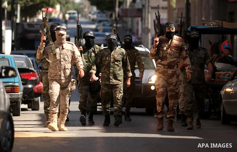 Palestinian militants of the Nasser Salah al-Din Brigades the military wing of the Popular Resistance movement take part in a press conference, in Gaza City on Sept. 27, 2016. Photo by Ashraf Amra