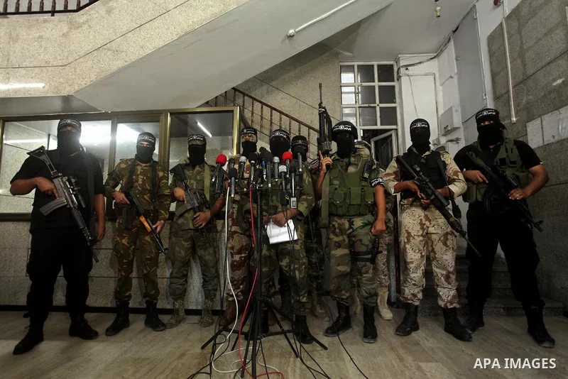 Palestinian militants of the Nasser Salah al-Din Brigades the military wing of the Popular Resistance movement take part in a press conference, in Gaza City on Sept. 27, 2016. Photo by Ashraf Amra