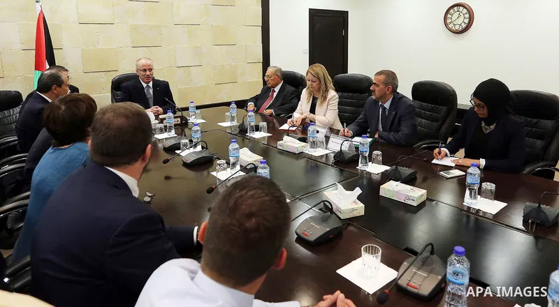 Palestinian Prime Minister, Rami Hamdallah, meets with Head of French Socialist Party (PS) Jean-Christophe Cambadelis, in the West Bank city, of Ramallah, Sep. 27, 2016. Photo by Prime Minister Office
