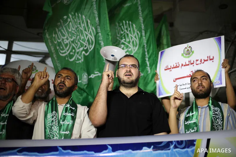 Palestinian Hamas supporters take part in a rally marking 16th anniversary of the so-called Al-Aqsa uprising or 'Second Intifada', in Gaza city on Sep. 28, 2016. Photo by Mohammed Asad