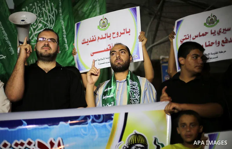 Palestinian Hamas supporters take part in a rally marking 16th anniversary of the so-called Al-Aqsa uprising or 'Second Intifada', in Gaza city on Sep. 28, 2016. Photo by Mohammed Asad