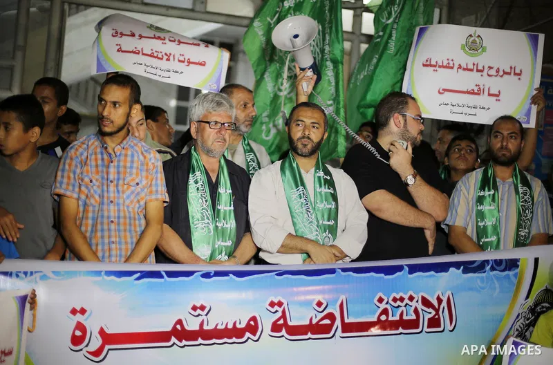 Palestinian Hamas supporters take part in a rally marking 16th anniversary of the so-called Al-Aqsa uprising or 'Second Intifada', in Gaza city on Sep. 28, 2016. Photo by Mohammed Asad