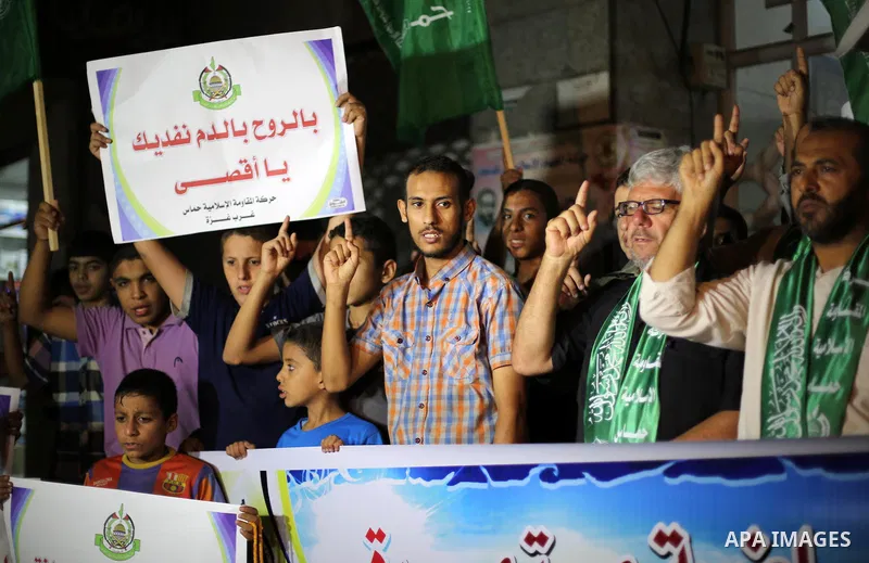 Palestinian Hamas supporters take part in a rally marking 16th anniversary of the so-called Al-Aqsa uprising or 'Second Intifada', in Gaza city on Sep. 28, 2016. Photo by Mohammed Asad