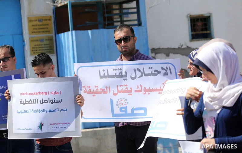 Palestinian journalists take part in a protest against Facebook decision to block Palestinian news sites' accounts, outside the UNESCO headquarters in Gaza City on Sep. 29, 2016. Editors from two Palestinian news publica...