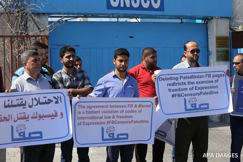 Palestinian journalists take part in a protest against Facebook decision to block Palestinian news sites' accounts, outside the UNESCO headquarters in Gaza City on Sep. 29, 2016. Editors from two Palestinian news publica...