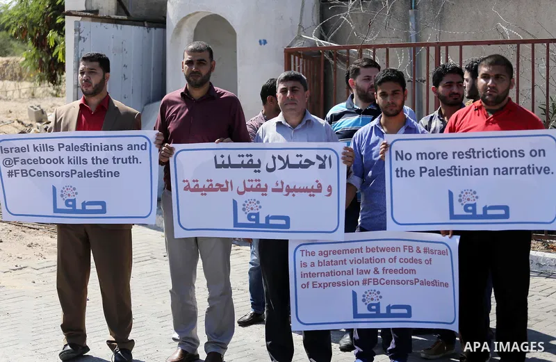 Palestinian journalists take part in a protest against Facebook decision to block Palestinian news sites' accounts, outside the UNESCO headquarters in Gaza City on Sep. 29, 2016. Editors from two Palestinian news publica...