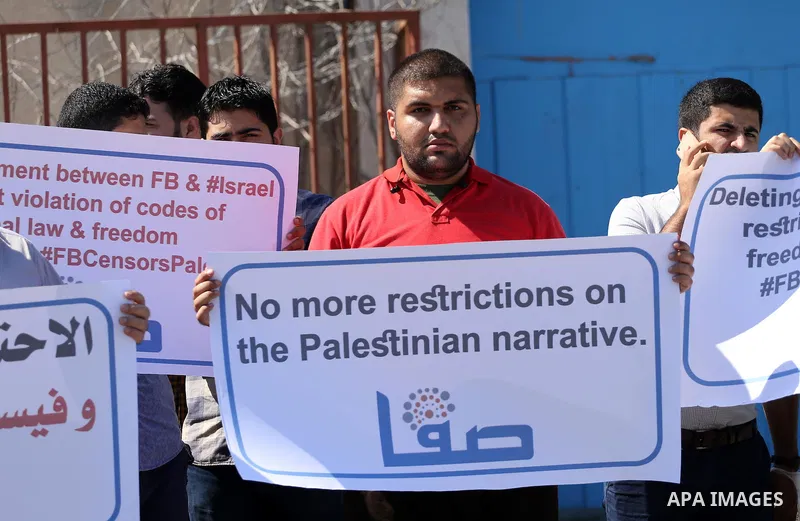 Palestinian journalists take part in a protest against Facebook decision to block Palestinian news sites' accounts, outside the UNESCO headquarters in Gaza City on Sep. 29, 2016. Editors from two Palestinian news publica...