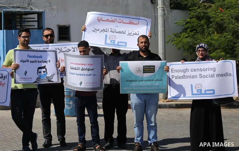 Palestinian journalists take part in a protest against Facebook decision to block Palestinian news sites' accounts, outside the UNESCO headquarters in Gaza City on Sep. 29, 2016. Editors from two Palestinian news publica...
