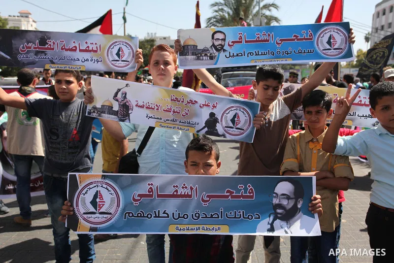 Palestinian supporters of the Islamic Jihad Movement take part in a demonstration marking the first anniversary of the so-called Al-Quds uprising in Gaza city, on October 2, 2016. Photo by Ashraf Amra