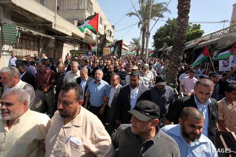 Palestinian supporters of the Islamic Jihad Movement take part in a demonstration marking the first anniversary of the so-called Al-Quds uprising in Gaza city, on October 2, 2016. Photo by Ashraf Amra
