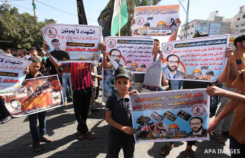 Palestinian supporters of the Islamic Jihad Movement take part in a demonstration marking the first anniversary of the so-called Al-Quds uprising in Gaza city, on October 2, 2016. Photo by Ashraf Amra