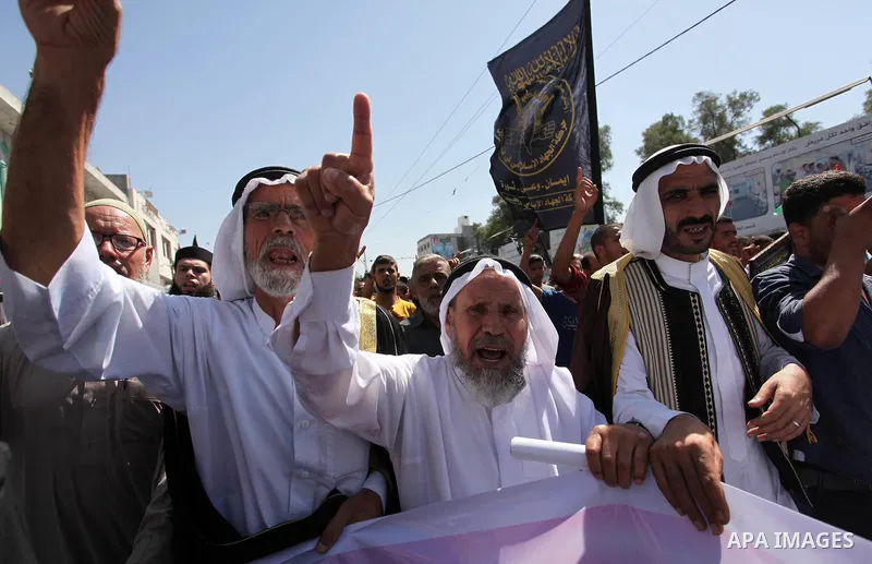 Palestinian supporters of the Islamic Jihad Movement take part in a demonstration marking the first anniversary of the so-called Al-Quds uprising in Gaza city, on October 2, 2016. Photo by Ashraf Amra