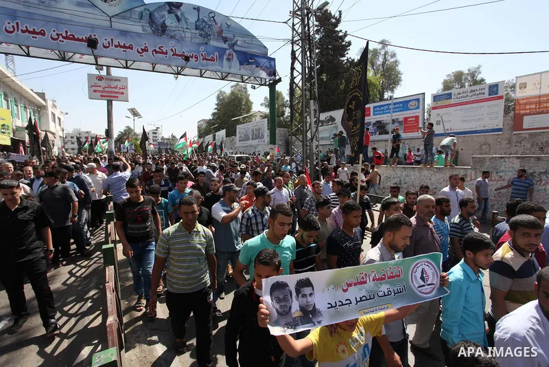 Palestinian supporters of the Islamic Jihad Movement take part in a demonstration marking the first anniversary of the so-called Al-Quds uprising in Gaza city, on October 2, 2016. Photo by Ashraf Amra