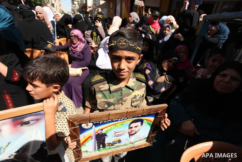 Palestinian supporters of the Islamic Jihad Movement take part in a demonstration marking the first anniversary of the so-called Al-Quds uprising in Gaza city, on October 2, 2016. Photo by Ashraf Amra