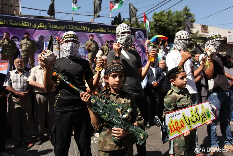 Palestinian supporters of the Islamic Jihad Movement take part in a demonstration marking the first anniversary of the so-called Al-Quds uprising in Gaza city, on October 2, 2016. Photo by Ashraf Amra