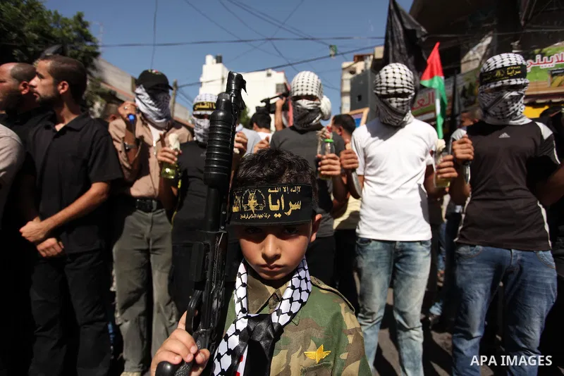 Palestinian supporters of the Islamic Jihad Movement take part in a demonstration marking the first anniversary of the so-called Al-Quds uprising in Gaza city, on October 2, 2016. Photo by Ashraf Amra