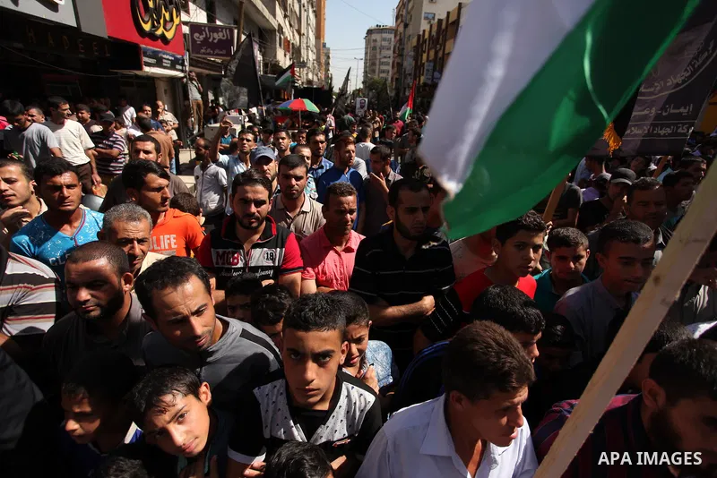 Palestinian supporters of the Islamic Jihad Movement take part in a demonstration marking the first anniversary of the so-called Al-Quds uprising in Gaza city, on October 2, 2016. Photo by Ashraf Amra
