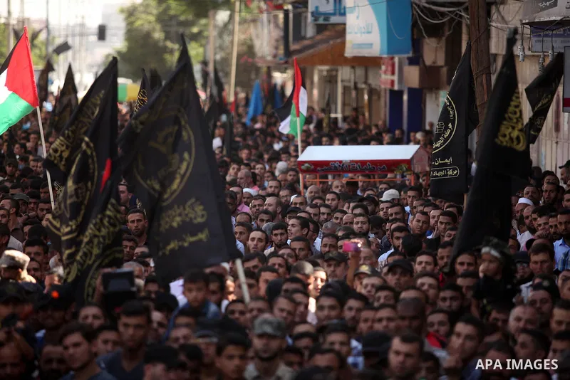 Palestinian supporters of the Islamic Jihad Movement take part in a demonstration marking the first anniversary of the so-called Al-Quds uprising in Gaza city, on October 2, 2016. Photo by Ashraf Amra