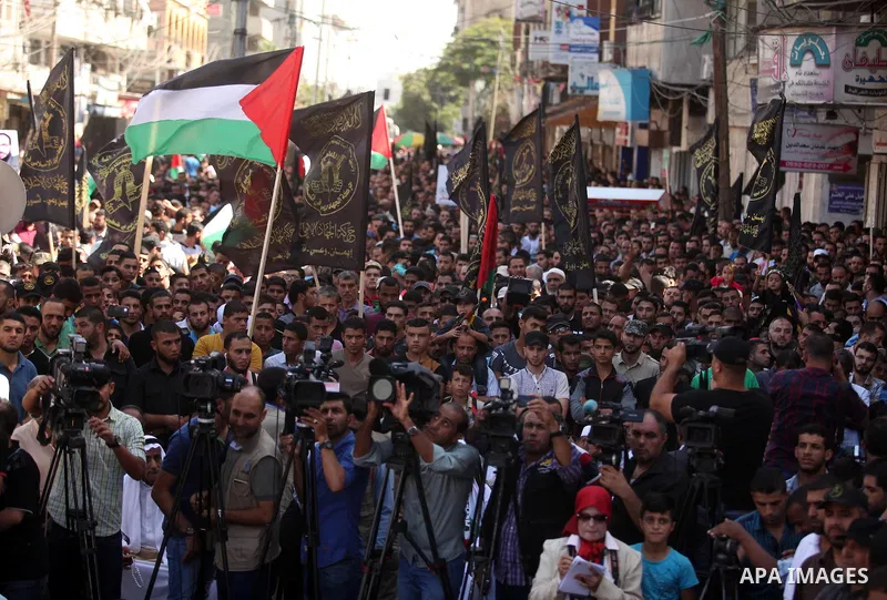 Palestinian supporters of the Islamic Jihad Movement take part in a demonstration marking the first anniversary of the so-called Al-Quds uprising in Gaza city, on October 2, 2016. Photo by Ashraf Amra