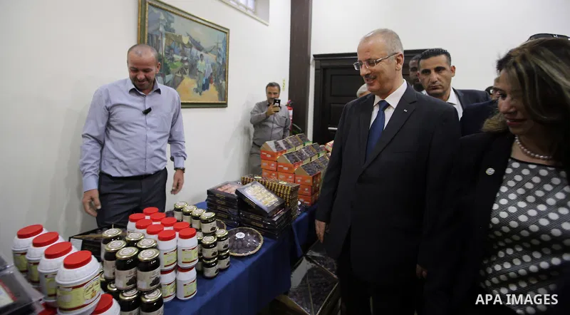 Palestinian Prime Minister, Rami Hamdallah, attends the launch of the national plan for sustainable production and consumption, in the West bank city of Ramallah, Oct. 05, 2016. Photo by Prime Minister Office
