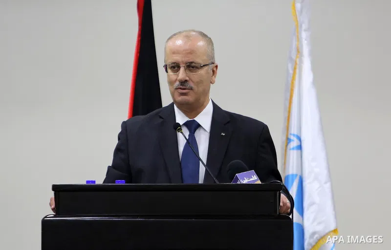 Palestinian Prime Minister, Rami Hamdallah, attends the launch of the national plan for sustainable production and consumption, in the West bank city of Ramallah, Oct. 05, 2016. Photo by Prime Minister Office