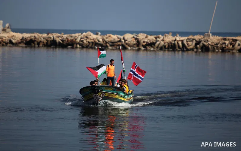 Palestinians show their solidarity with a Gaza-bound flotilla of international activists attempting to break the Israeli blockade on the Hamas-run Gaza Strip, on October 5, 2016 at the port in Gaza City. A group of women...