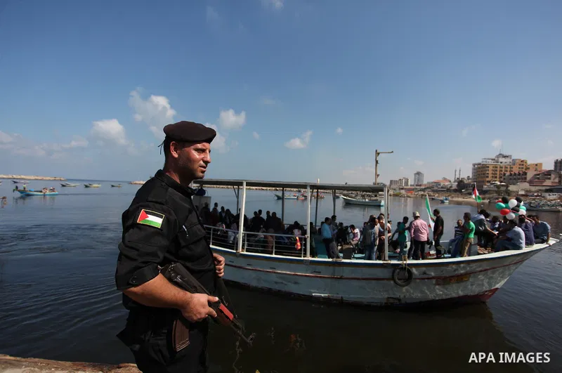 Palestinians show their solidarity with a Gaza-bound flotilla of international activists attempting to break the Israeli blockade on the Hamas-run Gaza Strip, on October 5, 2016 at the port in Gaza City. A group of women...