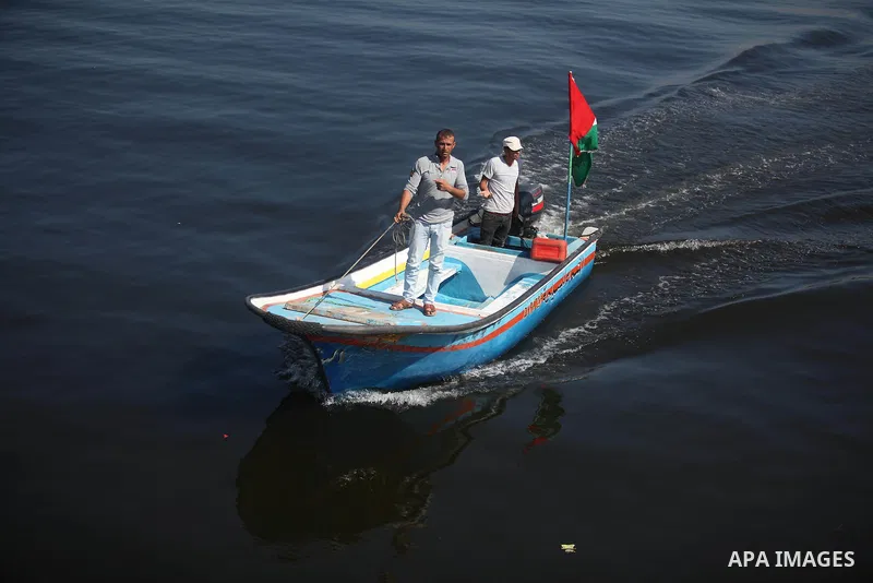 Palestinians show their solidarity with a Gaza-bound flotilla of international activists attempting to break the Israeli blockade on the Hamas-run Gaza Strip, on October 5, 2016 at the port in Gaza City. A group of women...
