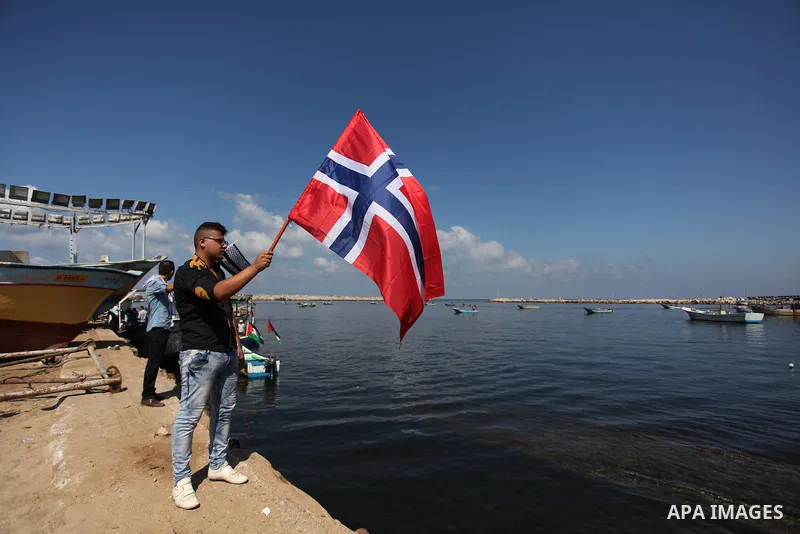 Palestinians show their solidarity with a Gaza-bound flotilla of international activists attempting to break the Israeli blockade on the Hamas-run Gaza Strip, on October 5, 2016 at the port in Gaza City. A group of women...