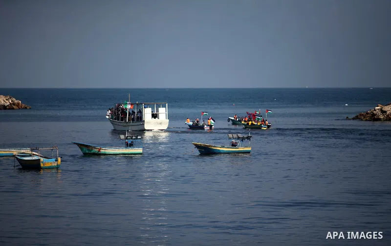 Palestinians show their solidarity with a Gaza-bound flotilla of international activists attempting to break the Israeli blockade on the Hamas-run Gaza Strip, on October 5, 2016 at the port in Gaza City. A group of women...